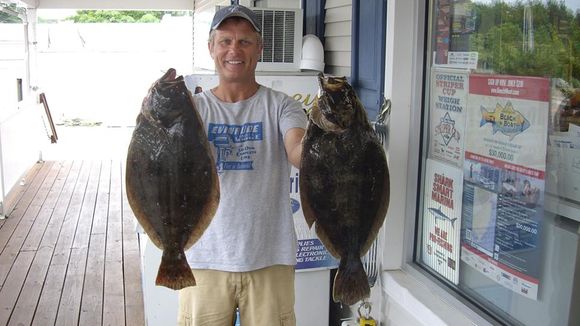John Howell holds two summer flounder that weighed more than 5.5 pounds each. (Photo: Provided)