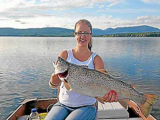 Photo provided In this photo from 2013, Ashley Rose of West Hurley displays a 24-inch, six-pound brown trout she caught in the Ashokan Reservoir