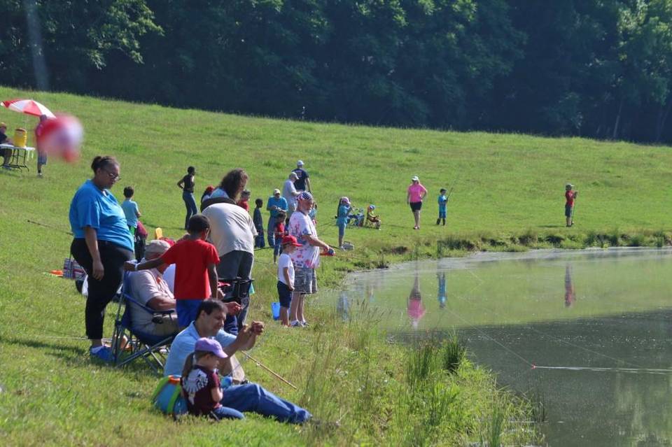 Kids, their parents and friends gather around Strayhorn’s Pond to take part in Saturday’s annual fishing rodeo. Randy Young