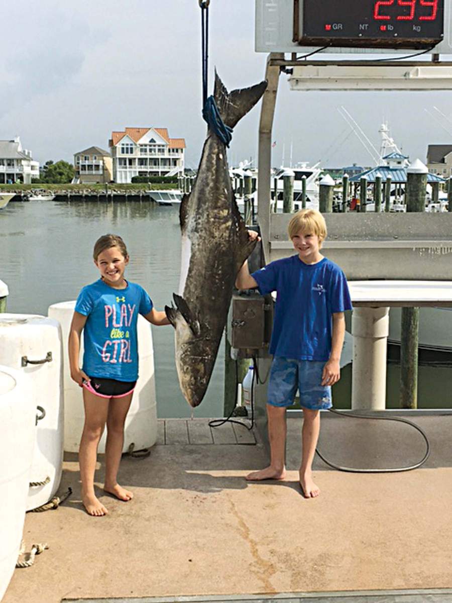 Nine-year-old Emma Zajdel, pictured with her friend, Ashton Clarke, caught a 94.6-pound cobia on June 30, topping the 79-pound state record set in 2014. They were fishing on her dad, Eddie&#039;s boat, Victorious, along with Clarke&#039;s father, Robert.