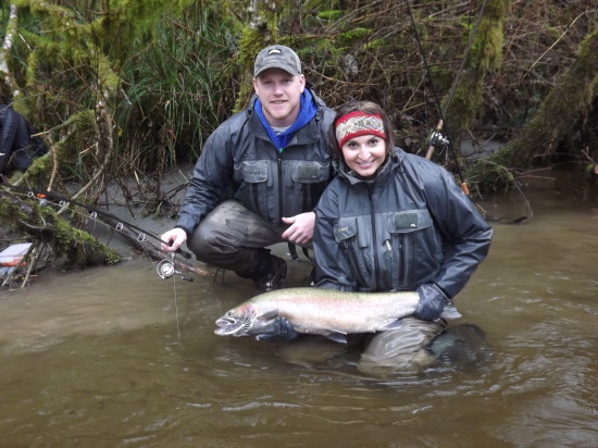 Combine tribal heritage, fish-catching skills and a 4.0 grade-point average at beauty school and what do you get? Ashley Nicole Lewis, here holding a nice Cook Creek steelhead while friend Darren Hoberg looks on. (JEFF HOLMES)